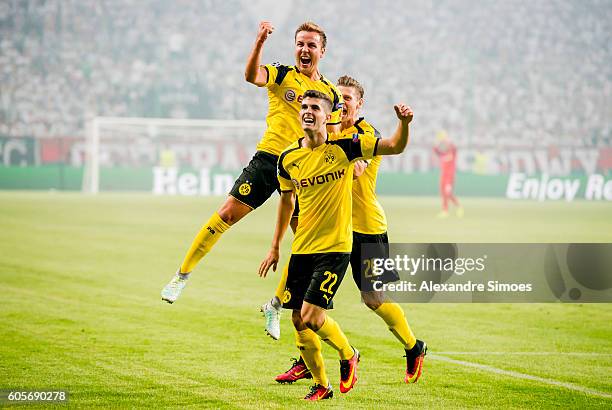 Mario Goetze of Borussia Dortmund celebrates after scoring the opening goal during the UEFA Champions League Group C match between Borussia Dortmund...