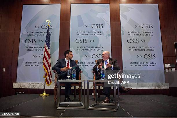 Director John Brennan speaks during a panel discussion moderated by National Security Division Deputy Assistant Attorney General Stuart J. Evans...