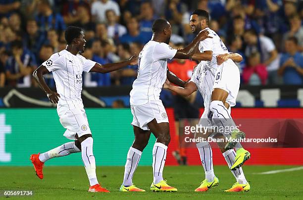 Riyad Mahrez of Leicester City celebrates with team mates as he scores from a free kick for their second goal during the UEFA Champions League match...