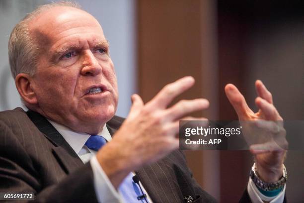 Director John Brennan speaks during a panel discussion moderated by National Security Division Deputy Assistant Attorney General Stuart J. Evans...
