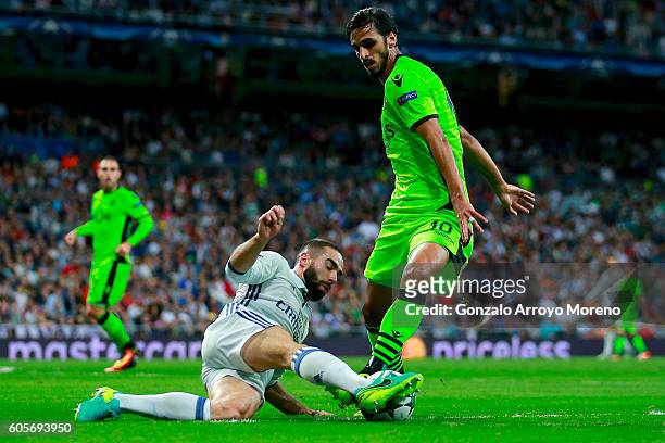 Daniel Carvajal of Real Madrid CF blocks Bryan Ruiz of Sporting CP during the UEFA Champions League group stage match between Real Madrid CF and...
