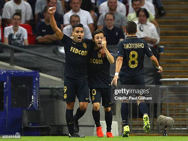 Bernardo Silva of Monaco celebrates with Radamel Falcao Garcia and Joao Moutinho as he scores their first goal during the UEFA Champions League match...