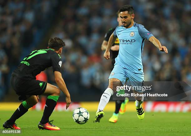Ilkay Gundogan in action with Oscar Wendt of Borussia Moenchengladbach during the UEFA Champions League match between Manchester City FC and VfL...