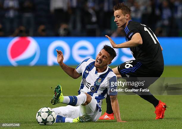 Porto's defender from Brazil Alex Telles tackled by FC Copenhagen's midfielder Jan Gregus during the UEFA Champions League match between FC Porto and...