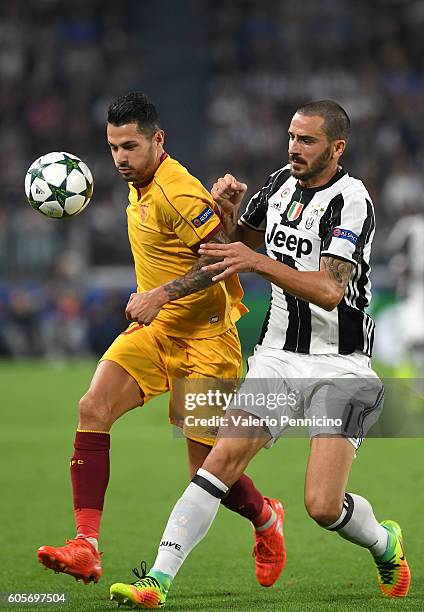 Leonardo Bonucci of Juventus FC clashes with Vitolo of Sevilla FC during the UEFA Champions League Group H match between Juventus FC and Sevilla FC...