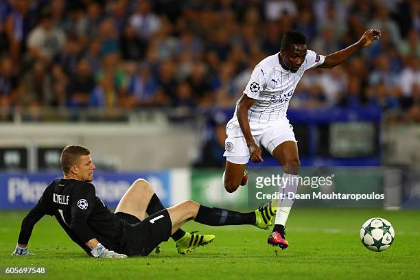 Ahmed Musa of Leicester City is challenged by Ludovic Butelle of Club Brugge during the UEFA Champions League match between Club Brugge KV and...