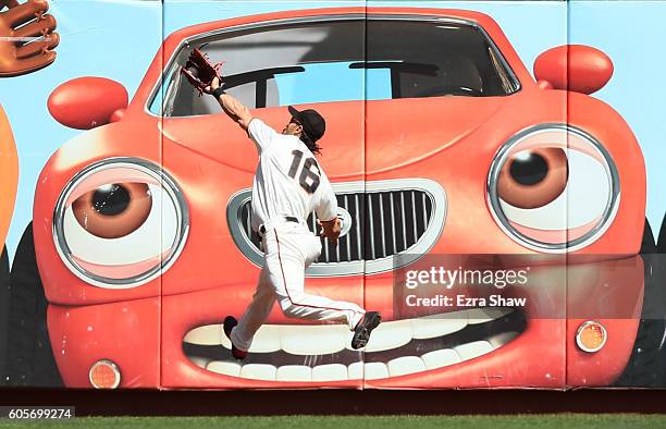 Angel Pagan of the San Francisco Giants catches a ball hit by Luis Sardinas of the San Diego Padres in the third inning at AT&T Park on September 14,...