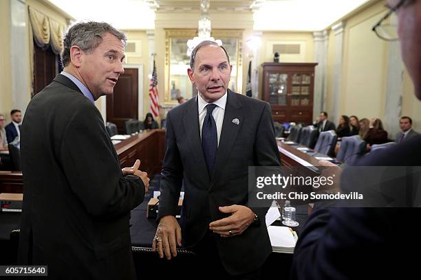 Sen. Sherrod Brown and Veterans Affairs Secretary Robert McDonald visit before a hearing of the Senate Veterans' Affairs Committee in the Russell...