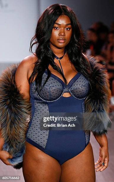 A model walks the runway at the Addition Elle Presents Holiday 2016 News  Photo - Getty Images