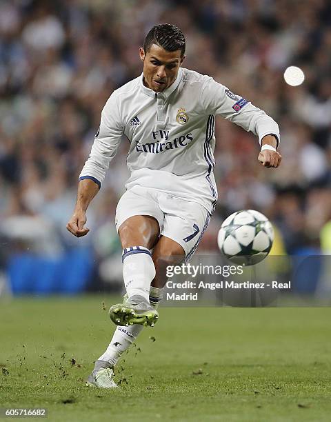 Cristiano Ronaldo of Real Madrid scores scores his sides equalising goal from a free kick during the UEFA Champions League Group F match between Real...