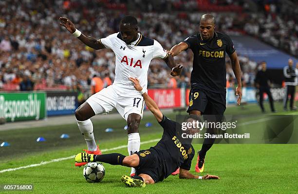 Moussa Sissoko of Tottenham Hotspur is challenged by Joao Moutinho of AS Monaco during the UEFA Champions League match between Tottenham Hotspur FC...