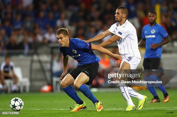 Islam Slimani of Leicester City pushes Bjoern Engels of Club Brugge during the UEFA Champions League match between Club Brugge KV and Leicester City...