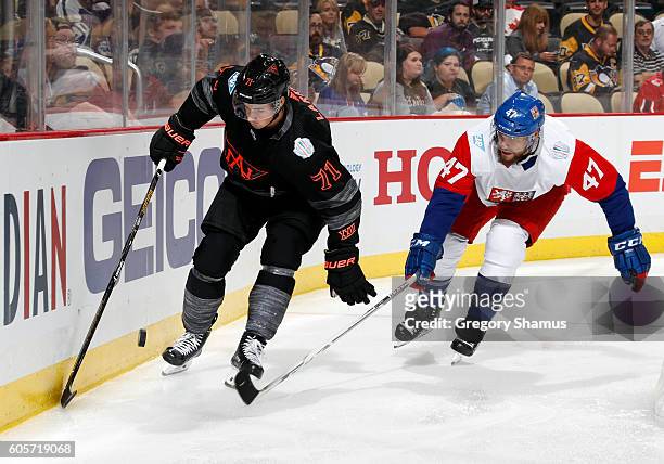 Dylan Larkin of Team North America skates against Michal Jordan of Team Czech Republic at Consol Energy Center on September 14, 2016 in Pittsburgh,...