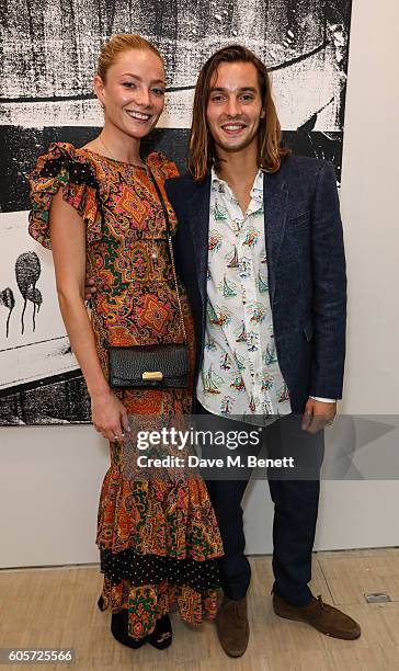 Clara Paget and Oscar Tuttiett attend a private view of 'Stutter', a new exhibition by Kingsley Ifill at The Cob Gallery on September 14, 2016 in...