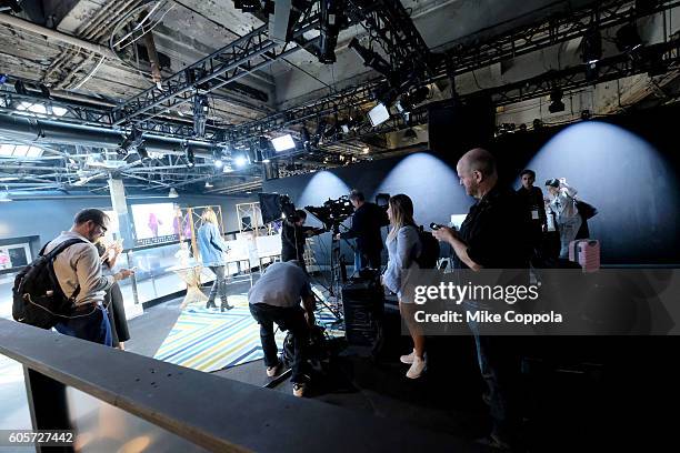 View of the production crew breaking down the E! studio seen around New York Fashion Week: The Shows at Skylight at Moynihan Station on September 14,...