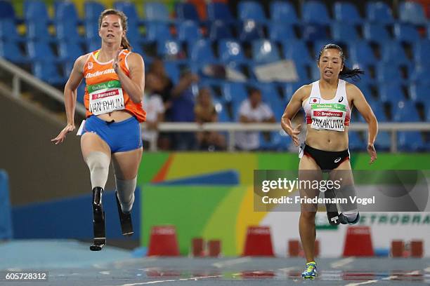 Marlou van Rhijn of the Netherlands and Saki Takakuwa of Japan compete in the Women's 200m - T44 Heat on day 7 of the Rio 2016 Paralympic Games at...