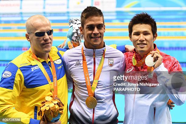 Silver medalist KIMURA Keiichi of JAPAN celebrates on the podium at the medal ceremony for the Men's 100m Butterfly - S11 Final on day 7 of the Rio...