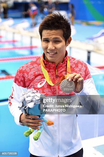 Silver medalist KIMURA Keiichi of JAPAN celebrates on the podium at the medal ceremony for the Men's 100m Butterfly - S11 Final on day 7 of the Rio...