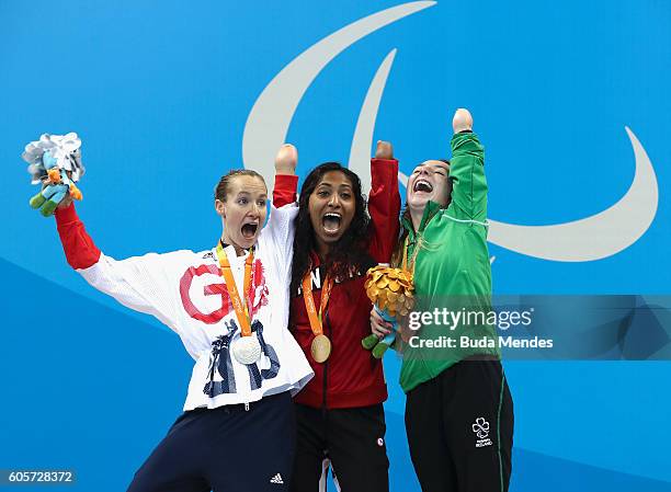 Silver medalist Claire Cashmore of Great Britain, gold medalist Katarina Roxon of Canada and bronze medalist Ellen Keane of Ireland celebrate on the...