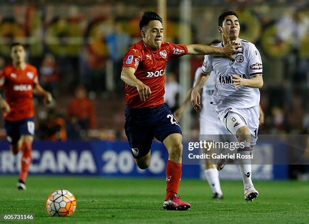 Miguel Almiron of Lanus is fouled by Gustavo Toledo of Independiente during a match between Independiente and Lanus as part of Copa Sudamericana 2016...