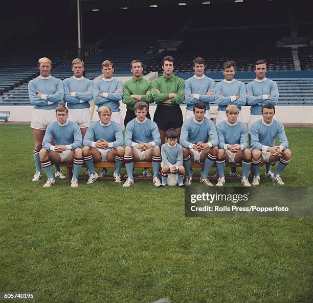 View of the Manchester City FC football team posed together on the pitch inside Maine Road stadium in Manchester in July 1968 at the start of the...