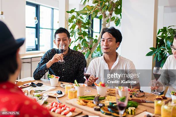 friends relaxing together - party food and drink stock pictures, royalty-free photos & images