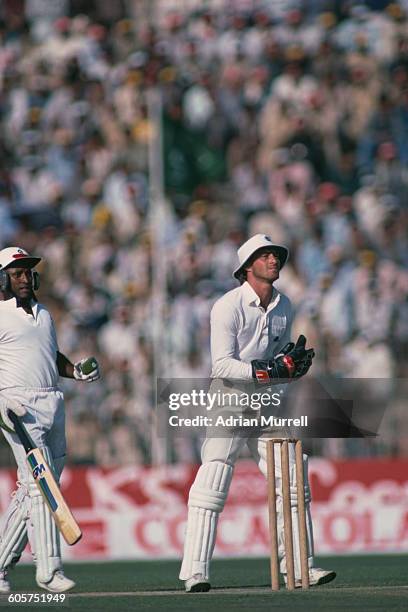 England cricketer Graeme Fowler keeping wicket in a One Day International against Pakistan at the Gaddafi Stadium, Lahore, Pakistan, 9th March 1984....