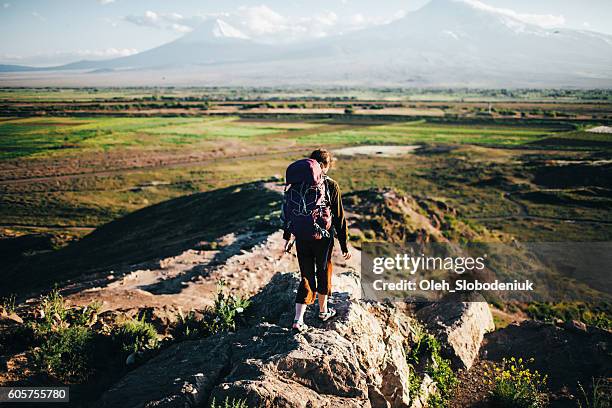 woman with backpack on the background of ararat - armenia girls stockfoto's en -beelden