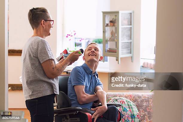 young cerebral palsy patient - persons with disabilities stock pictures, royalty-free photos & images