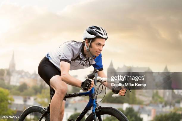 caucasian man cycling outdoors - spandex stock pictures, royalty-free photos & images