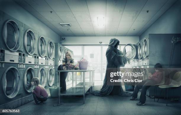 stockillustraties, clipart, cartoons en iconen met grim reaper doing laundry at laundromat - alleenstaande moeder