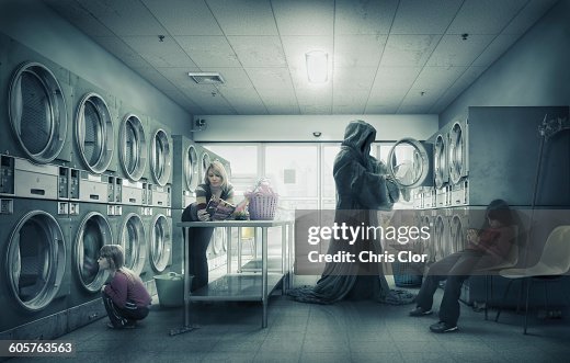 Grim Reaper doing laundry at laundromat Grim Reaper doing laundry at laundromat