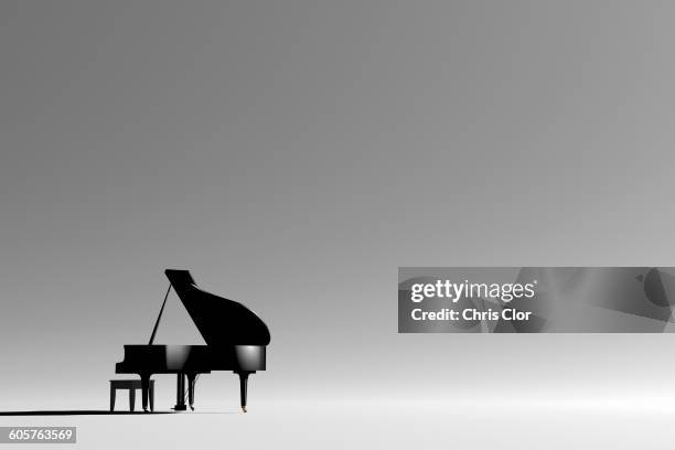 grand piano and bench in empty room - grand piano film stock-fotos und bilder