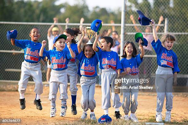 baseball team cheering on field - team sport celebration stock pictures, royalty-free photos & images