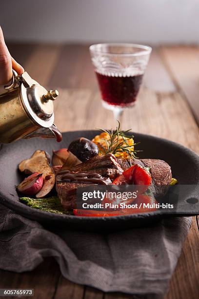 beef steak  - wine glass finger food stock-fotos und bilder