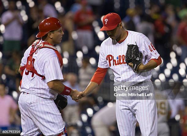 Ellis and Jeanmar Gomez of the Philadelphia Phillies shake hands after the last out of the game against the Pittsburgh Pirates at Citizens Bank Park...