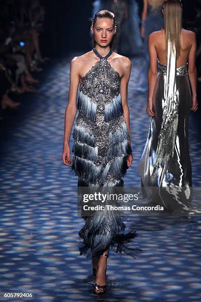 Model walks the runway wearing Marchesa Spring 2017 at The Dock, Skylight at Moynihan Station during New York Fashion Week on September 14, 2016 in...