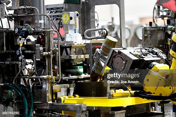 Grippers move 155mm shells through the munition washout system at the Pueblo Chemical agent Pilot plant training area. The neutralization of...