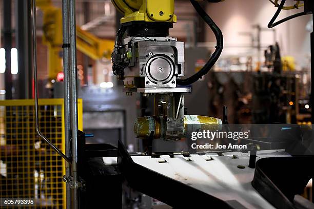 Grippers move 155mm shells through the munition washout system at the Pueblo Chemical agent Pilot plant training area. The neutralization of...