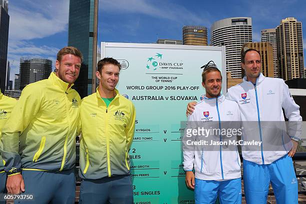 Australian Davis Cup players Sam Groth and John Peers pose with Andrej Martin and Igor Zelenay of Slovakia during the Davis Cup World Group Playoff...