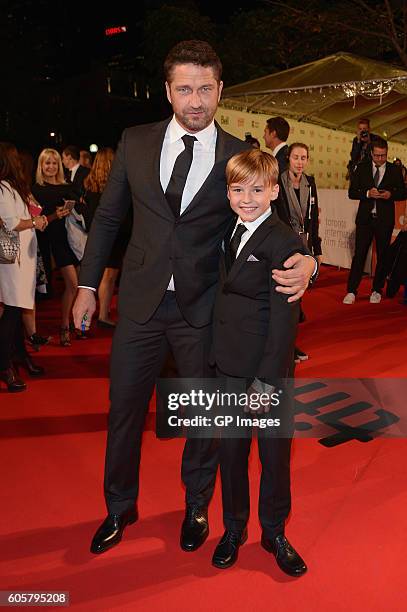 Actors Gerard Butler and Maxwell Jenkins attend "The Headhunter's Calling" premiere during 2016 Toronto International Film Festival at Roy Thomson...