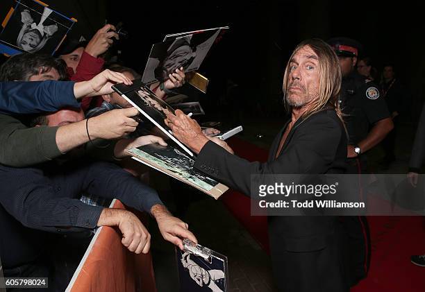 Iggy Pop signs autographs at the Premiere of Amazon Studios' "Gimme Danger" at the Toronto International Film Festival at Ryerson Theatre on...