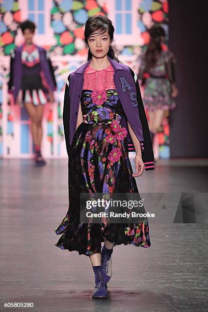 Model walks the runway during the Anna Sui September 2016 New York Fashion Week: The Shows Spring 2017 season at The Arc, Skylight at Moynihan...