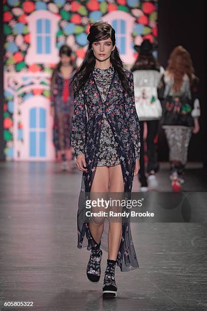 Model walks the runway during the Anna Sui September 2016 New York Fashion Week: The Shows Spring 2017 season at The Arc, Skylight at Moynihan...