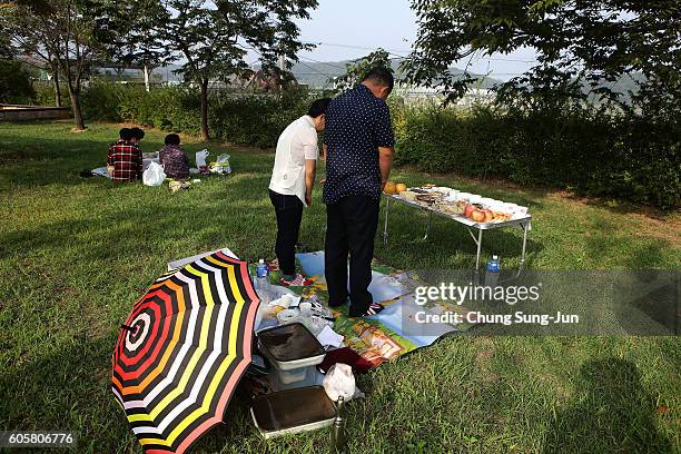 North Korean defector Jang Yoon-Nam and Nam Sun-Hee pay respects to their ancestors in North Korea during a ceremony to mark the Chuseok, the Korean...