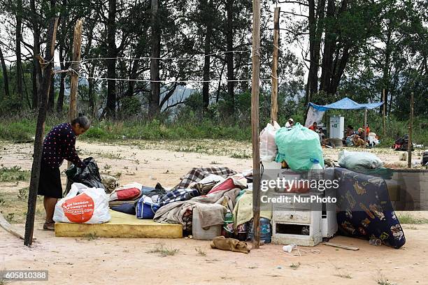 Activists and volunteers provide relief to residents this Wednesday afternoon after a fire consumed the Ocupação Esperança, a slum community on...