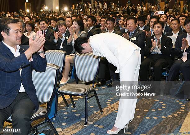 Renho bows during applause after being selected as the new chief of the Democratic Party at a Tokyo hotel on Sept. 15, 2016. The 48-year-old...