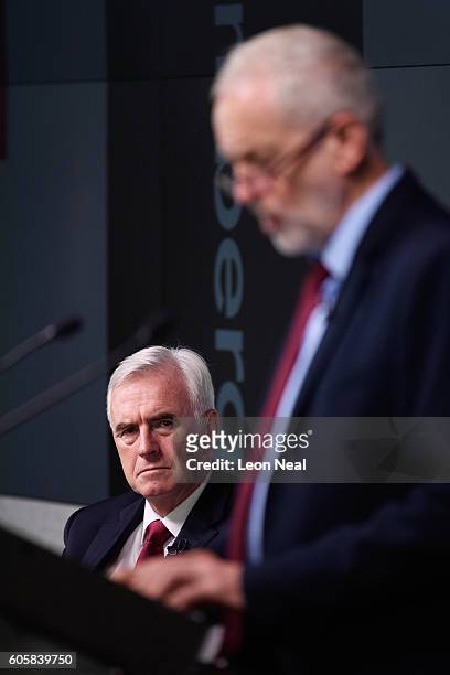 Labour Party leader Jeremy Corbyn is watched by Shadow Chancellor John McDonnell as he delivers a keynote speech on the future of the economy, held...