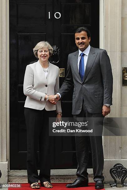 British Prime Minister Theresa May greets His Highness Sheikh Tamim bin Hamad al Thani, The Emir of Qatar outside 10 Downing Street on September 15,...