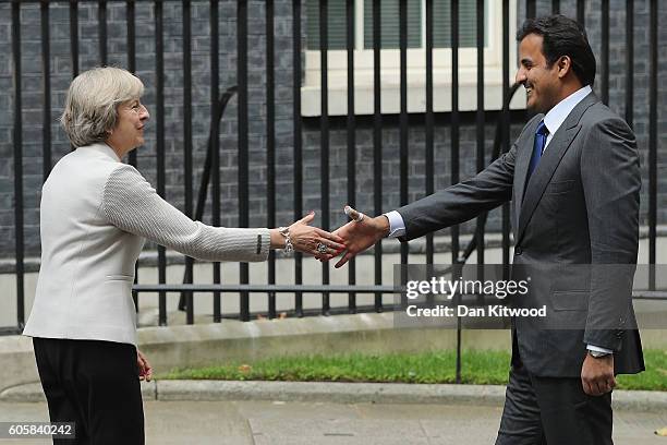 British Prime Minister Theresa May greets His Highness Sheikh Tamim bin Hamad al Thani, The Emir of Qatar outside 10 Downing Street on September 15,...